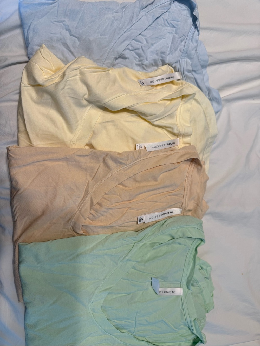 Aritzia short sleeve tees in pastels - light blue, pale yellow, peach, mint